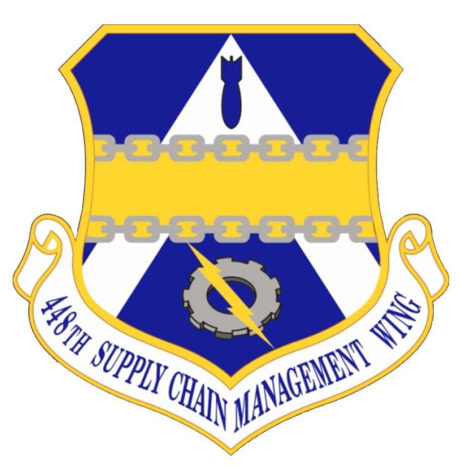 Logo des 48. Versorgungsgeschwader mit einem blauen Schild mit einem weißen Stern und einem weißen Banner mit der Aufschrift "Versorgungsgeschwader" in blau, alles von einem weißen Rand mit der schwarzen Schrift "48. Versorgungsgeschwader" umgeben.