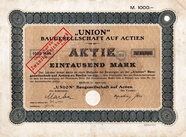 Alte deutsche Banknote mit rotem Stempel und Text, wahrscheinlich eine Aktie.