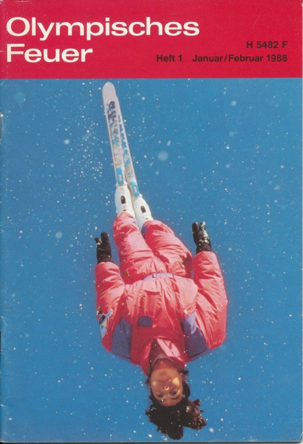 Buchumschlag mit einem Skifahrer in der Luft mit dem Text "Olympische Spiele Feuer - Heft 1 - Januar/Februar 1988", der einen Ski-Anzug trägt und entschlossen aussieht.